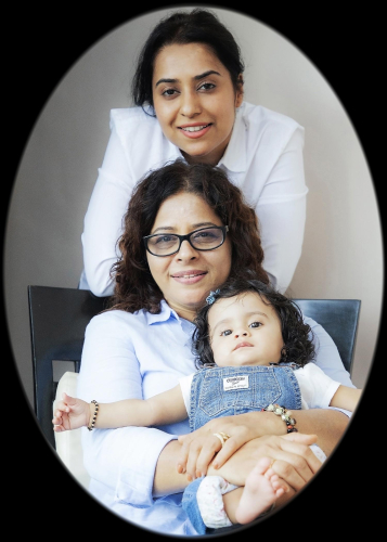 family portrait of a woman and a baby in a chair