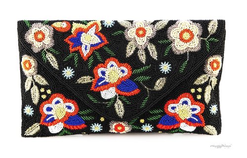 product shoot of a beaded clutch bag with a colorful flower design
