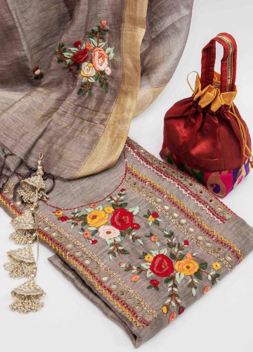 product shoot of a bag, purse, and a scarf with a flower design