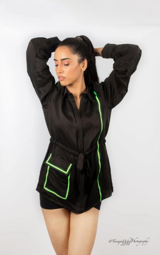 fashion shoot of a woman in a black shirt and shorts