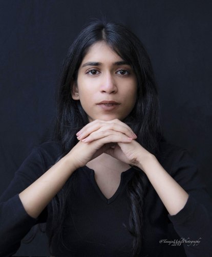portrait shoot of a woman with long black hair and a black shirt