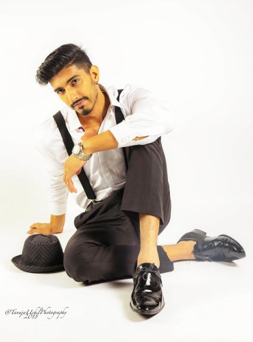portrait shoot of a man in a white shirt and black pants