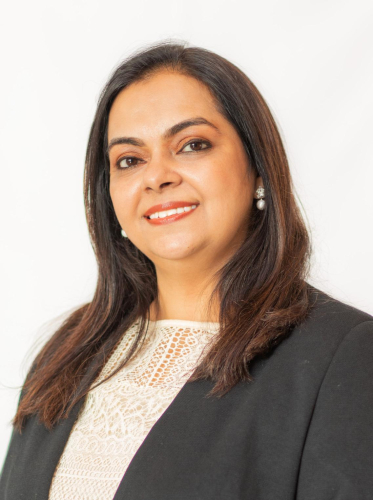 corporate headshot of a woman with long hair and a white blouse