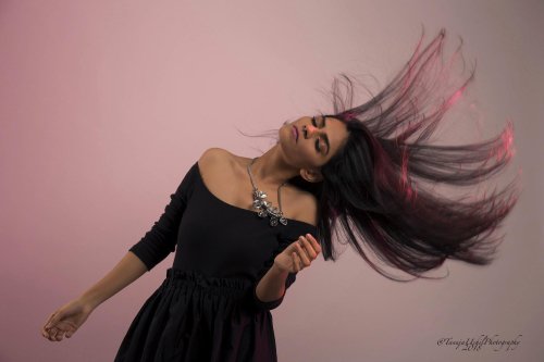 portrait shoot of a woman with long hair blowing in the wind