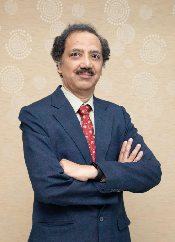 corporate headshot of a man in a suit and tie