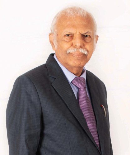 corporate headshot of a man in a suit and tie