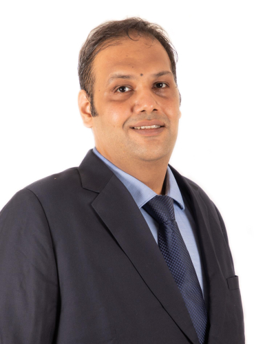 corporate headshot of a man in a suit and tie