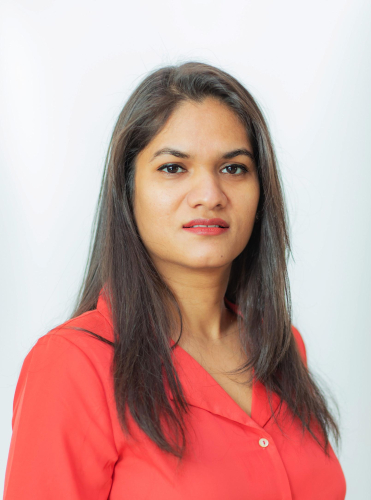 corporate headshot of a woman in a red shirt
