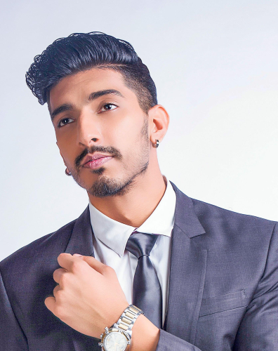 corporate headshot of a man in a suit and tie