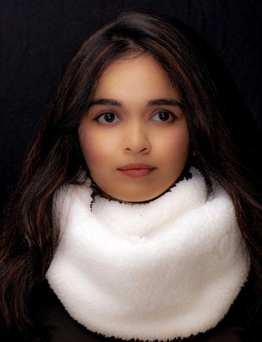 portrait shoot of a woman with long dark hair wearing a white scarf