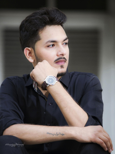 portrait shoot of a man with a watch on his wrist