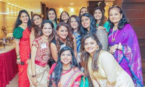 event picture of a group of women in saris posing for a picture